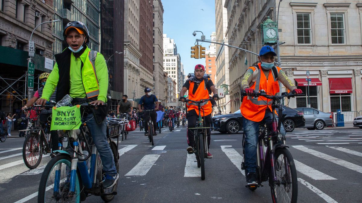 Delivery cyclists ride down Broadway in Manhattan to protest a lack of protection during the coronavirus pandemic, Oct. 15, 2020.