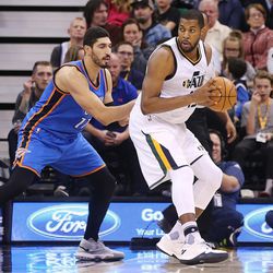 Oklahoma City Thunder center Enes Kanter (11) defends Utah Jazz forward Derrick Favors (15) as the Jazz and the Thunder play at Vivint Smart Home arena in Salt Lake City on Wednesday, Dec. 14, 2016.