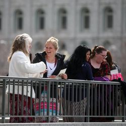 Sara Bingham talks with her mother Debbie Bingham, left, between sessions of the 183rd Annual General Conference of The Church of Jesus Christ of Latter-day Saints outside of the Conference Center in Salt Lake City on Sunday, April 7, 2013.