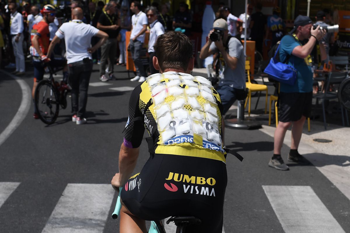 A cyclist of the Netherlands’ Jumbo-Visma cycling team wears a special plastic bib with several pockets filled with ice due to a heat wave during the Tour de France cycling race  on July 23, 2019.