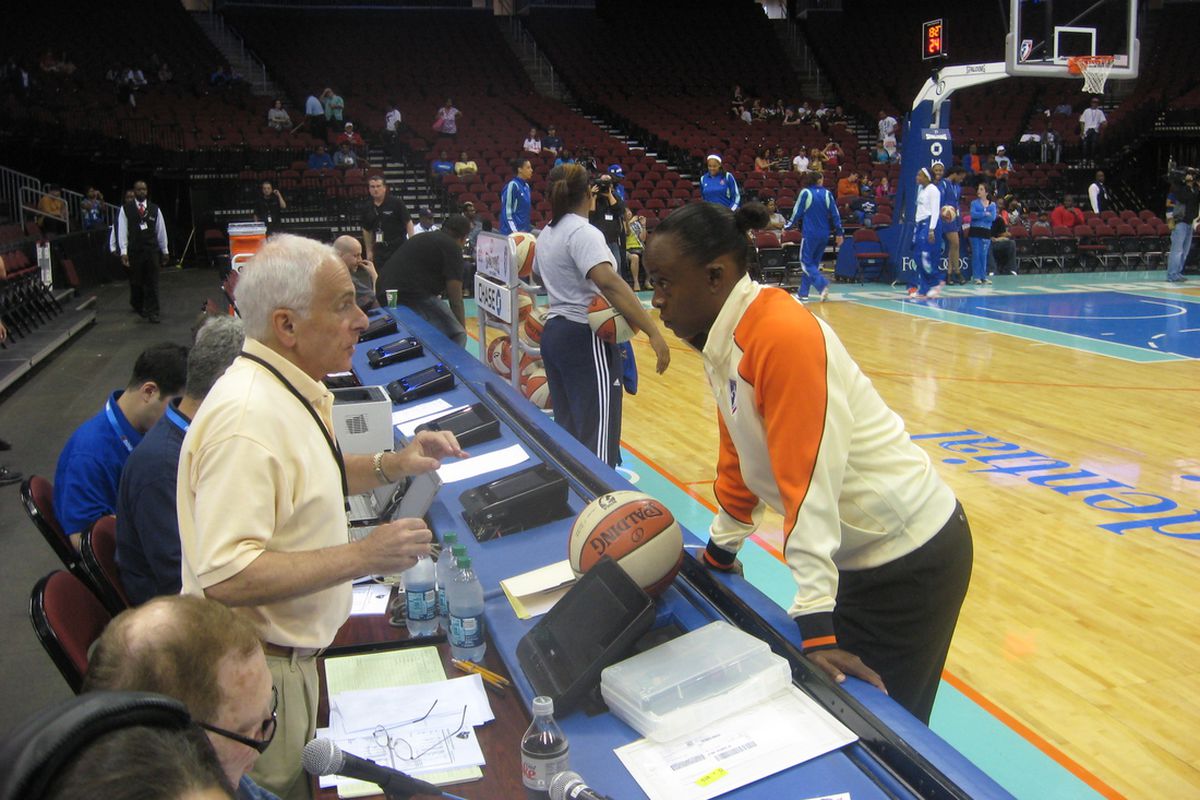 Official Denise Brroks has a pre-game chat with the official scorer at the Prudential Center before the New York Liberty's 87-72 win on Sunday. <em>Photo by Ray Floriani. </em>