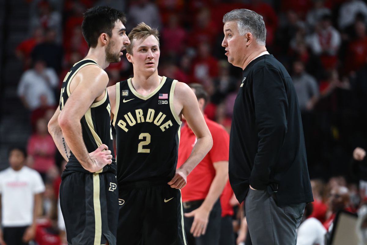 Dec 10, 2022; Lincoln, Nebraska, USA; Purdue Boilermakers head coach Matt Painter talks with guard Fletcher Loyer (2) and guard Ethan Morton (25) during a break in the action against the Nebraska Cornhuskers in the second half at Pinnacle Bank Arena.