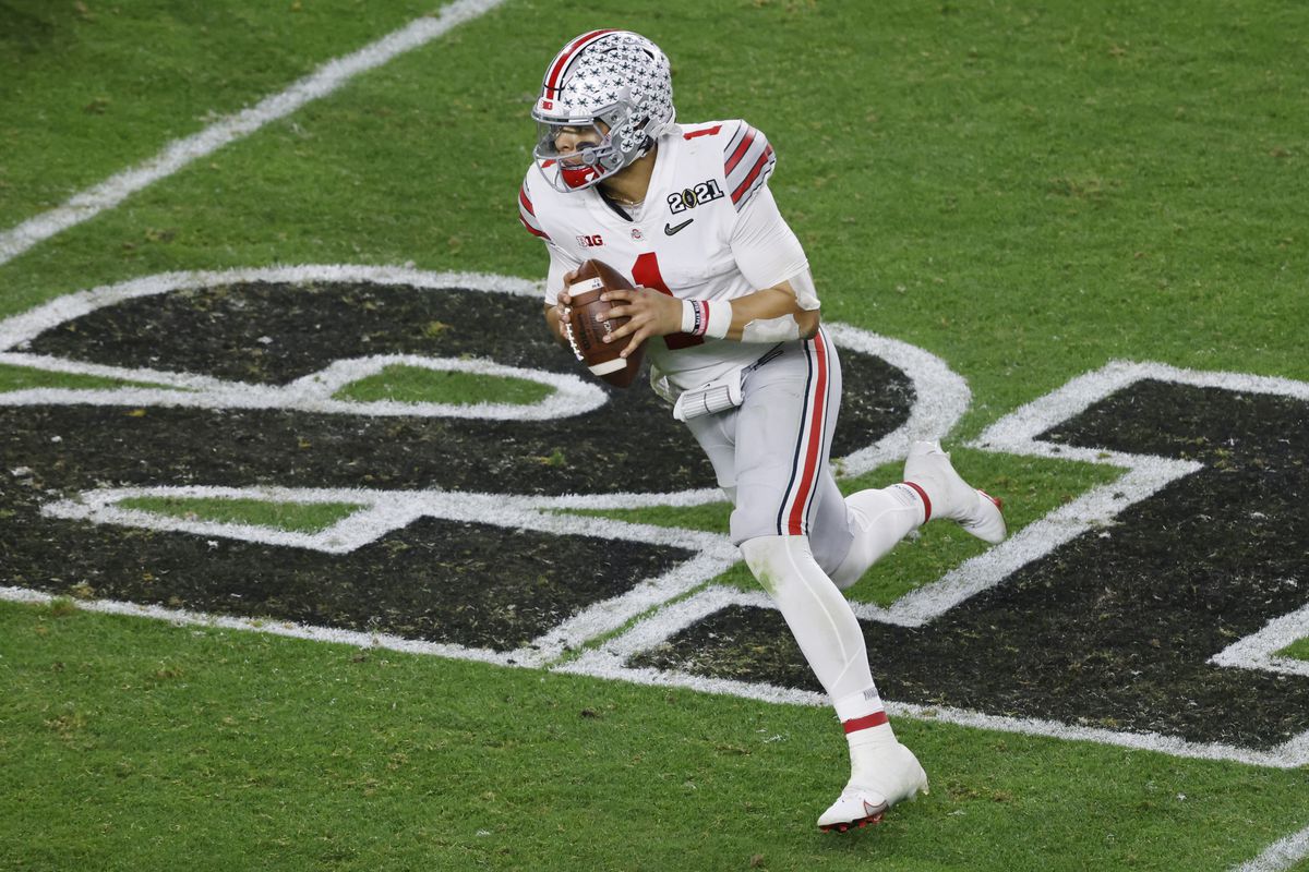 Justin Fields #1 of the Ohio State Buckeyes scrambles during the fourth quarter of the College Football Playoff National Championship game against the Alabama Crimson Tide at Hard Rock Stadium on January 11, 2021 in Miami Gardens, Florida.