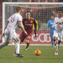 Real Salt Lake forward Corey Baird (27) runs for the ball as New York Red Bulls defender Tim Parker (26) and defender Kyle Duncan (6) close in during Real Salt Lake's 1-0 win against the New York Red Bulls at Rio Tinto Stadium in Sandy on Saturday, March 17, 2018.