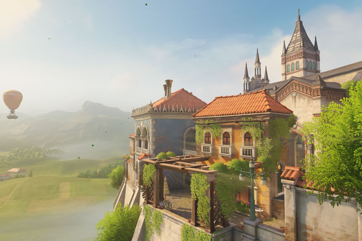 Overwatch - a shot of the Malevento map, which shows a charming Italian estate. In the distance is a hot air balloon.