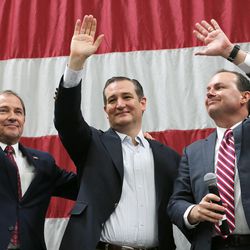 Utah Gov. Gary Herbert, left, joins GOP presidential candidate and Texas Sen. Ted Cruz, center, and Sen. Mike Lee, R-Utah, on stage at a rally in Draper at the American Preparatory Academy Saturday, March 19, 2016.