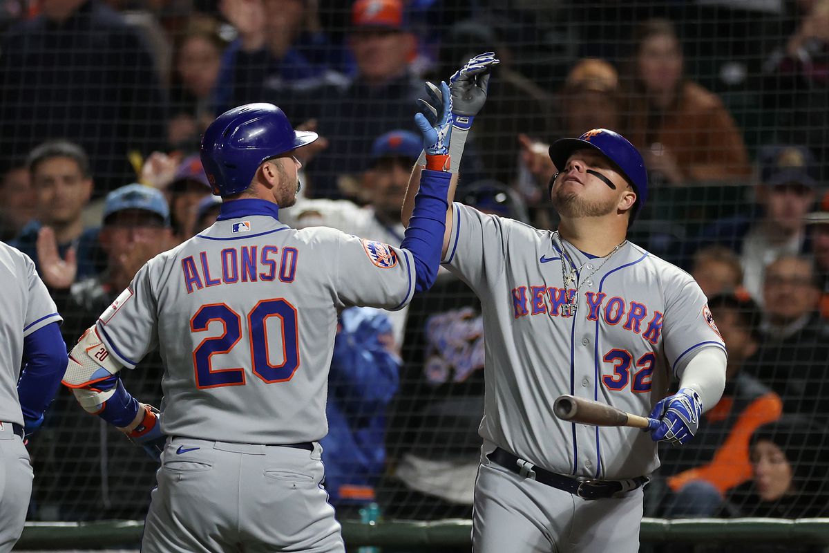 Pete Alonso of the New York Mets is congratulated by Daniel Vogelbach after hitting a home run against the San Francisco Giants in the fifth inning at Oracle Park on April 21, 2023 in San Francisco, California.