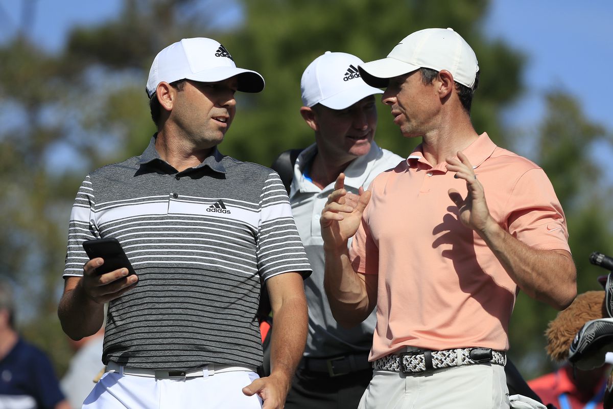Sergio Garcia of Spain and Rory McIlory of Northern Ireland walk together off a tee during a practice round prior to The PLAYERS Championship on The Stadium Course at TPC Sawgrass on March 11, 2020 in Ponte Vedra Beach, Florida.