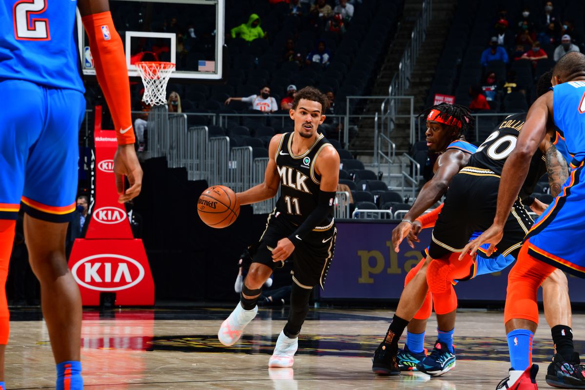 Trae Young #11 of the Atlanta Hawks dribbles the ball during the game against the Oklahoma City Thunder on March 18, 2021 at State Farm Arena in Atlanta, Georgia.
