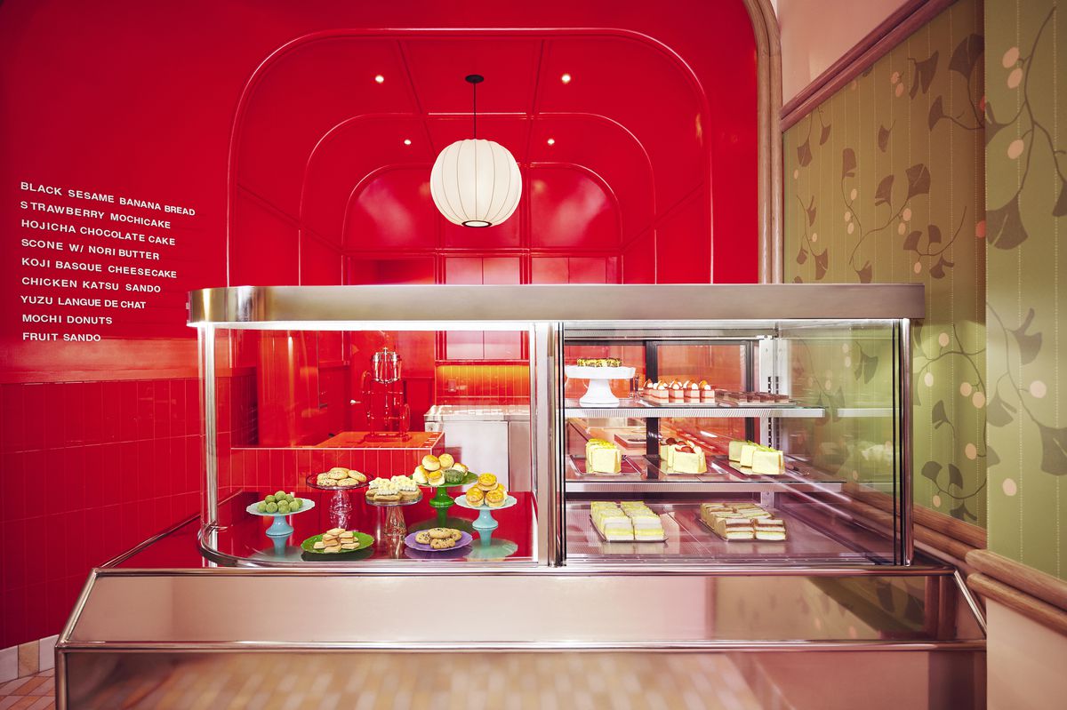 A red bakery with a slip of a display counter.