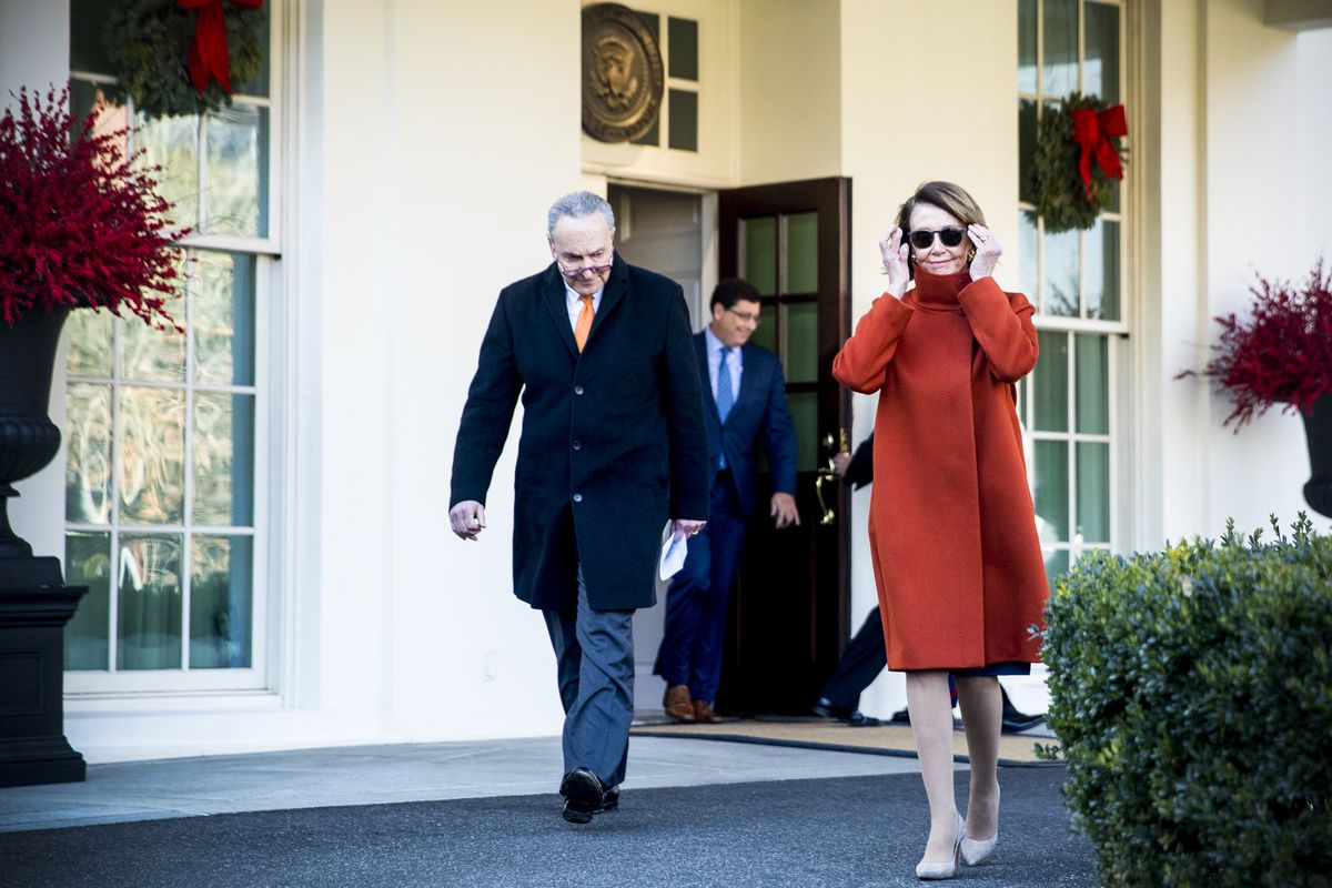 House Minority Leader Nancy Pelosi of (D-Calif.) and Senate Minority Leader Sen. Chuck Schumer of (D-N.Y.) walk out of the West Wing to speak to members of the media following a meeting with President Trump on December 11, 2018.