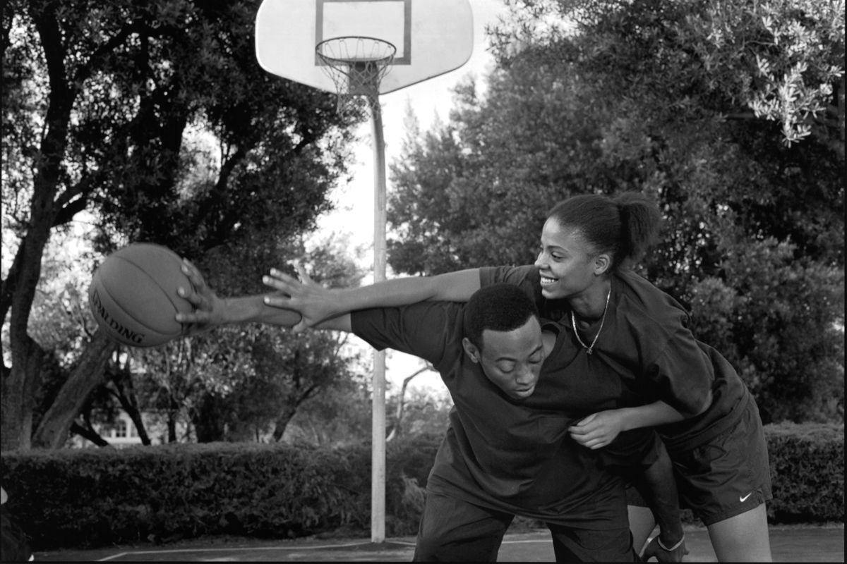 Actor Omar Epps and actress Sanaa Lathan on set of the movie “Love &amp; Basketball.”