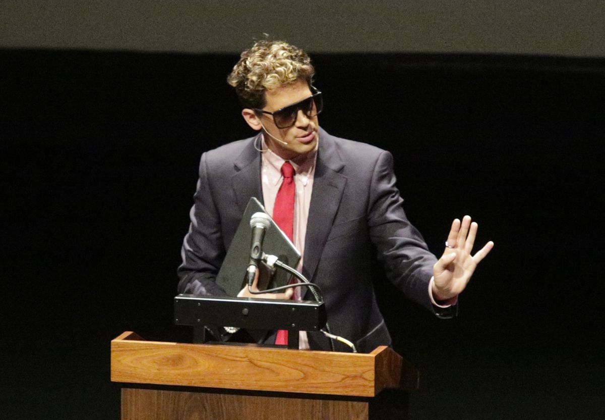 Milo Yiannopoulos, the polarizing Breitbart News editor, speaks at California Polytechnic State University on Tuesday.  His speech was met with dozens of angry protesters outside a campus theater. | David Middlecamp/The Tribune (of San Luis Obispo), distr