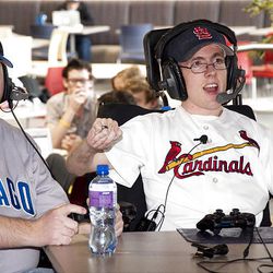 BYU-Idaho student Hans Smith, right, who has cerebral palsy, plays Sony PlayStation's "MLB: The Show" with a colleague at BYU-Idaho.