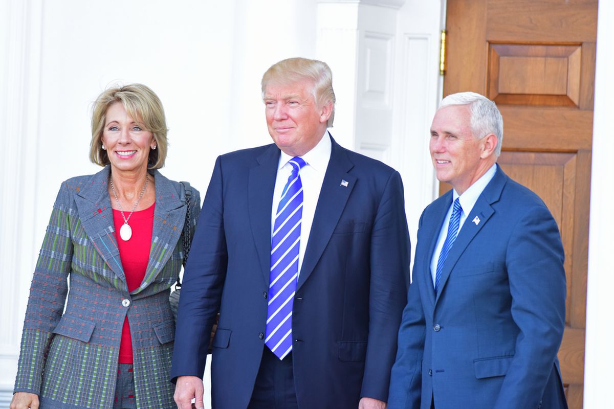Donald Trump with Betsy DeVos and Mike Pence. 