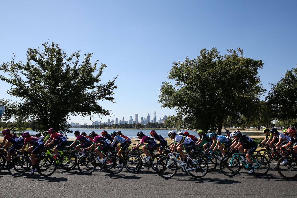 A group of cyclists on their bikes pedaling past an inlet during Women’s Race Melbourne at Albert Park.&nbsp;