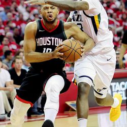 Utah Jazz forward Royce O'Neale (23) works to defend Houston Rockets guard Eric Gordon (10) as the Utah Jazz and the Houston Rockets play game two of the NBA playoffs at the Toyota Center in Houston on Wednesday, May 2, 2018.