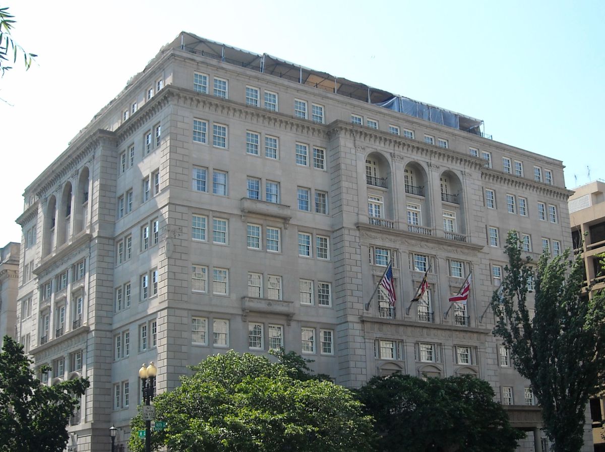 The exterior of the Hay-Adams Hotel in Washington. The facade is tan and there are multiple windows.