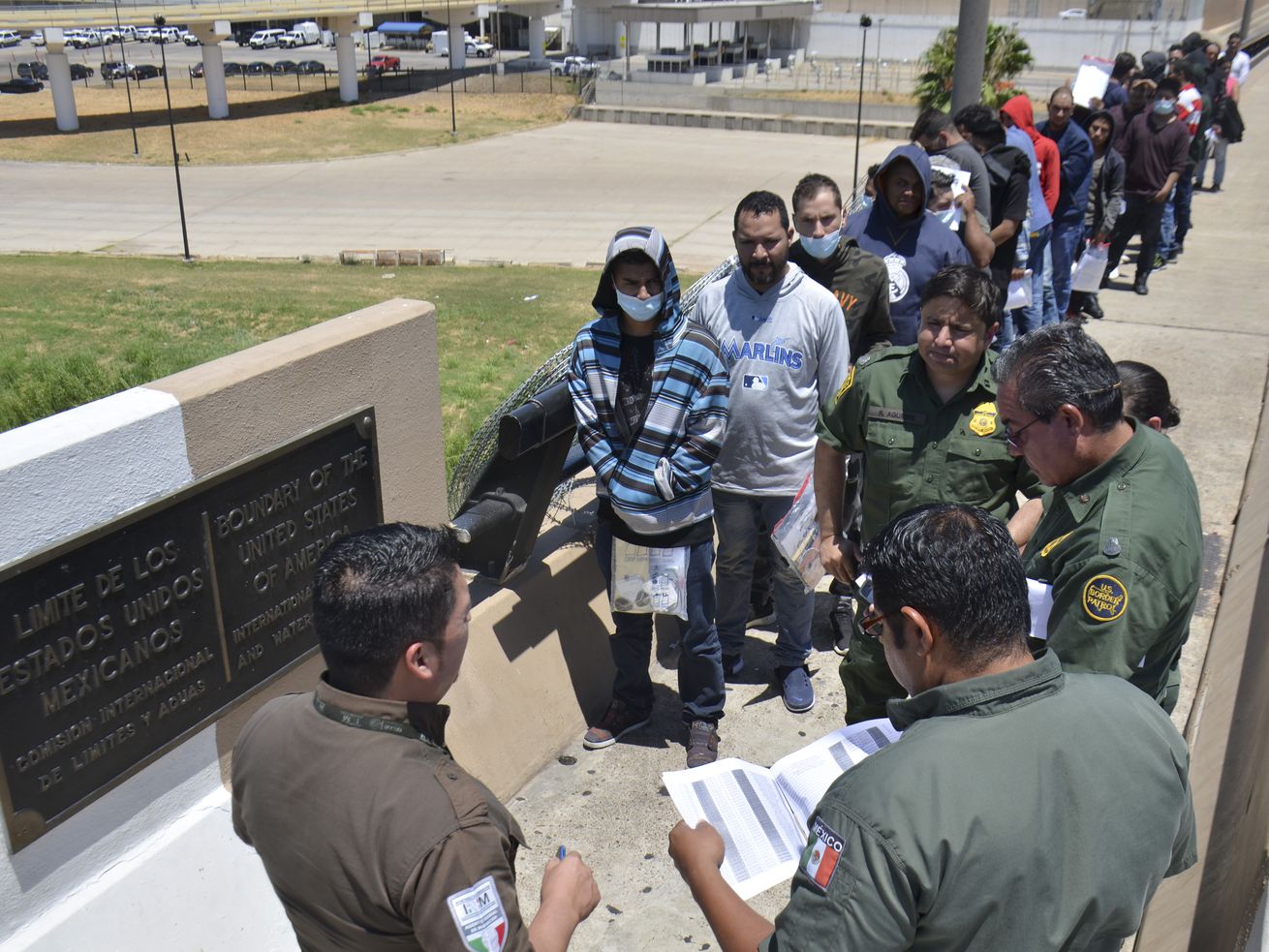 United States Border Patrol officers in Nuevo Laredo, Mexico, return a group of migrants to the Mexico side of the border earlier this month.