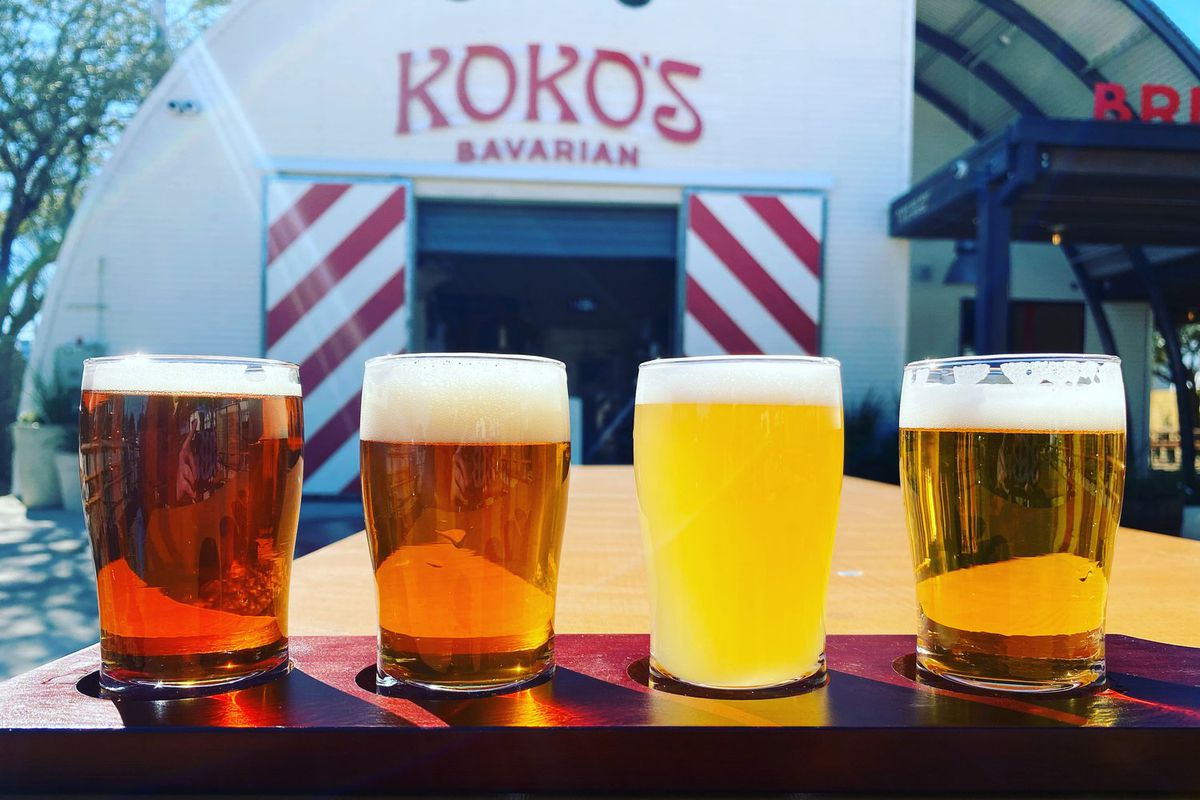 A row of beers in front of a building with a sign reading “Koko’s.”