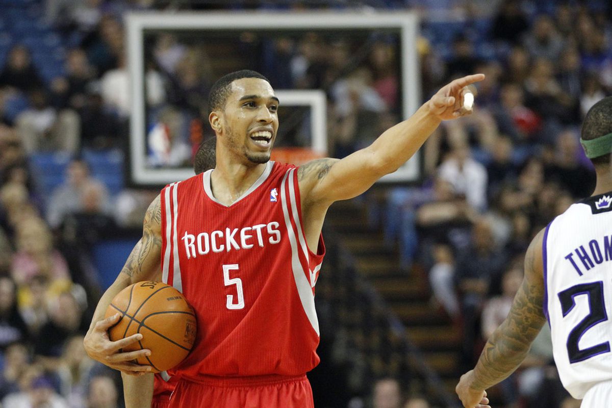 April 8, 2012; Sacramento, CA, USA; Houston Rockets guard Courtney Lee (5) points and laughs at Terrence Williams.  