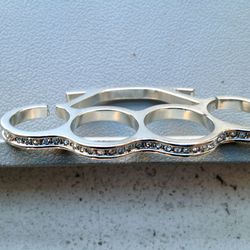 Brass knuckle ring, $50
