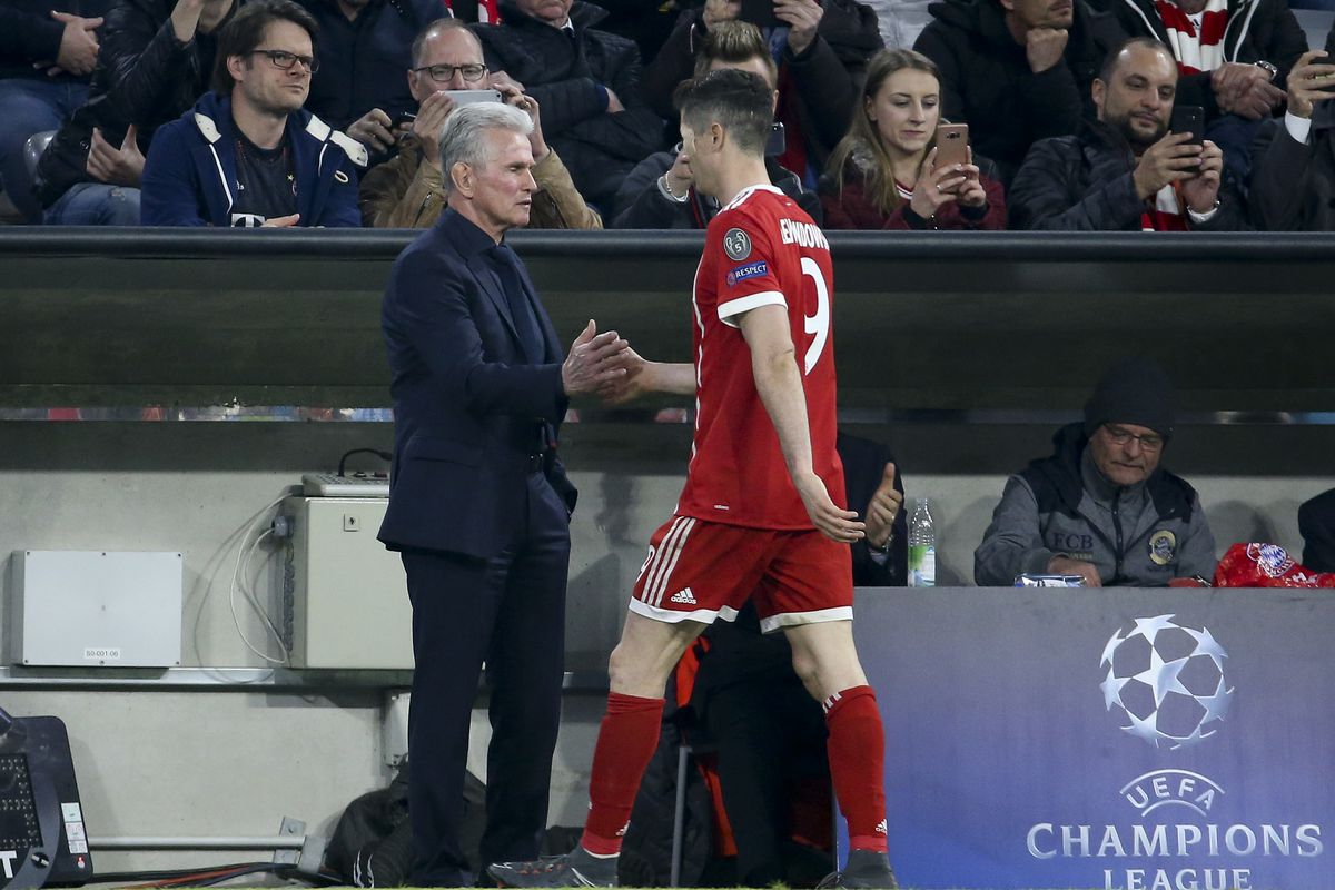 MUNICH, GERMANY - APRIL 11: Coach of Bayern Munich Jupp Heynckes greets Robert Lewandowski after he's replaced during the UEFA Champions League Quarter Final second leg match between Bayern Muenchen and FC Sevilla at Allianz Arena on April 11, 2018 in Munich, Germany.