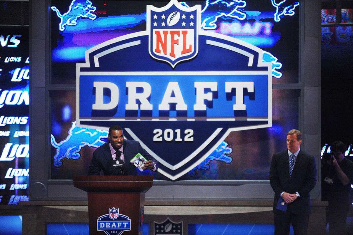 Detroit Lions wide receiver Calvin Johnson (left) announces Iowa tackle Riley Reiff (not pictured) as the Lions 23rd overall selection.