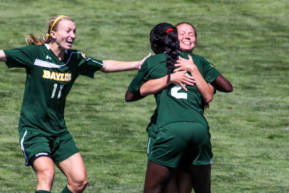 Precious Akanyirige (2) celebrating with teammates after her goal against BYU.