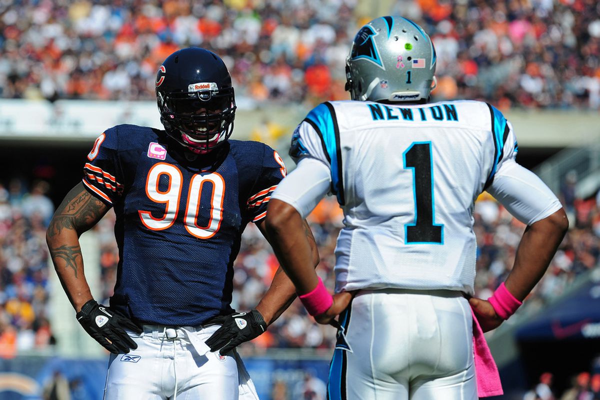 CHICAGO, IL - OCTOBER 2: Julius Peppers #90 of the Chicago Bears chats with Cam Newton #1 of the Carolina Panthers during a timeout at Soldier Field on October 2, 2011 in Chicago, Illinois. (Photo by Scott Cunningham/Getty Images)
