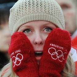 A Canadian fan watches team USA take on Canada in hockey during the Vancouver Winter Olympics on Sunday.