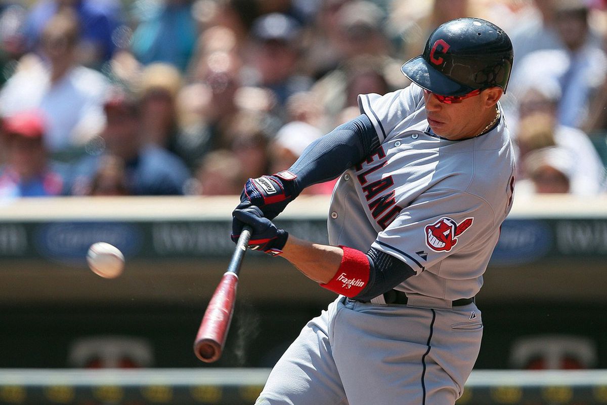 May 15, 2012; Minneapolis, MN, USA: Cleveland Indians shortstop Asdrubal Cabrera (13) hits a home run in the fifth inning against the Minnesota Twins at Target Field. Mandatory Credit: Jesse Johnson-US PRESSWIRE