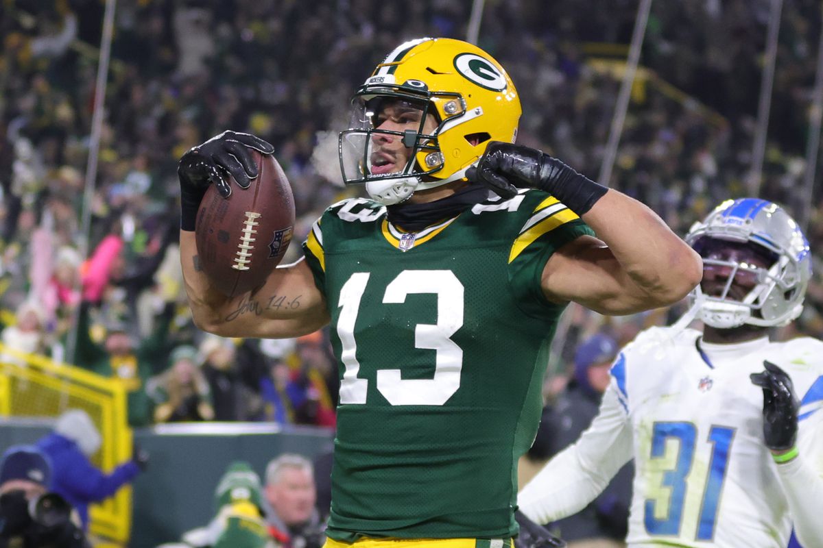 Allen Lazard #13 of the Green Bay Packers celebrates after a touchdown during the third quarter against the Detroit Lions at Lambeau Field on January 08, 2023 in Green Bay, Wisconsin.  