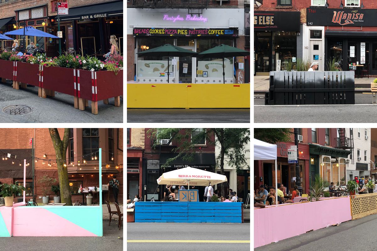 A grid of outdoor restaurants with colorfully painted plywood enclosures in maroon, yellow, blue, pink, and ombre gray.