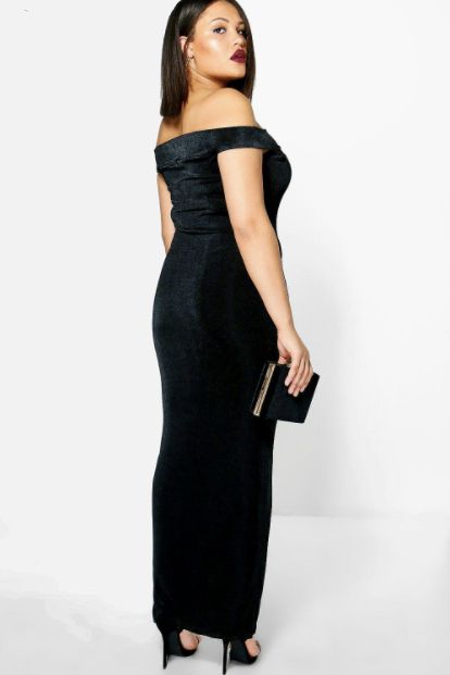 a plus-size model in a tight black dress