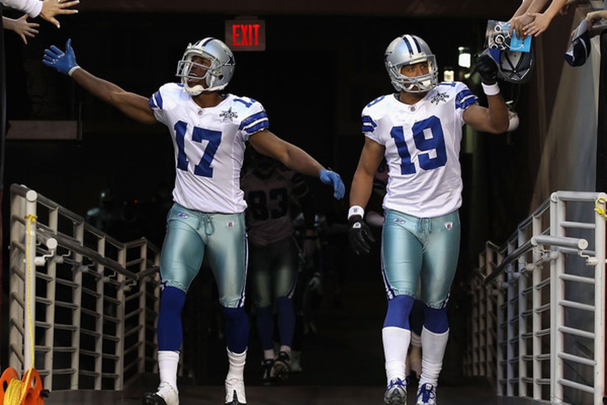 Cowboys receivers Hurd and Austin high-fiving fans after hearing of the Cowboys' 2011 strength of schedule.