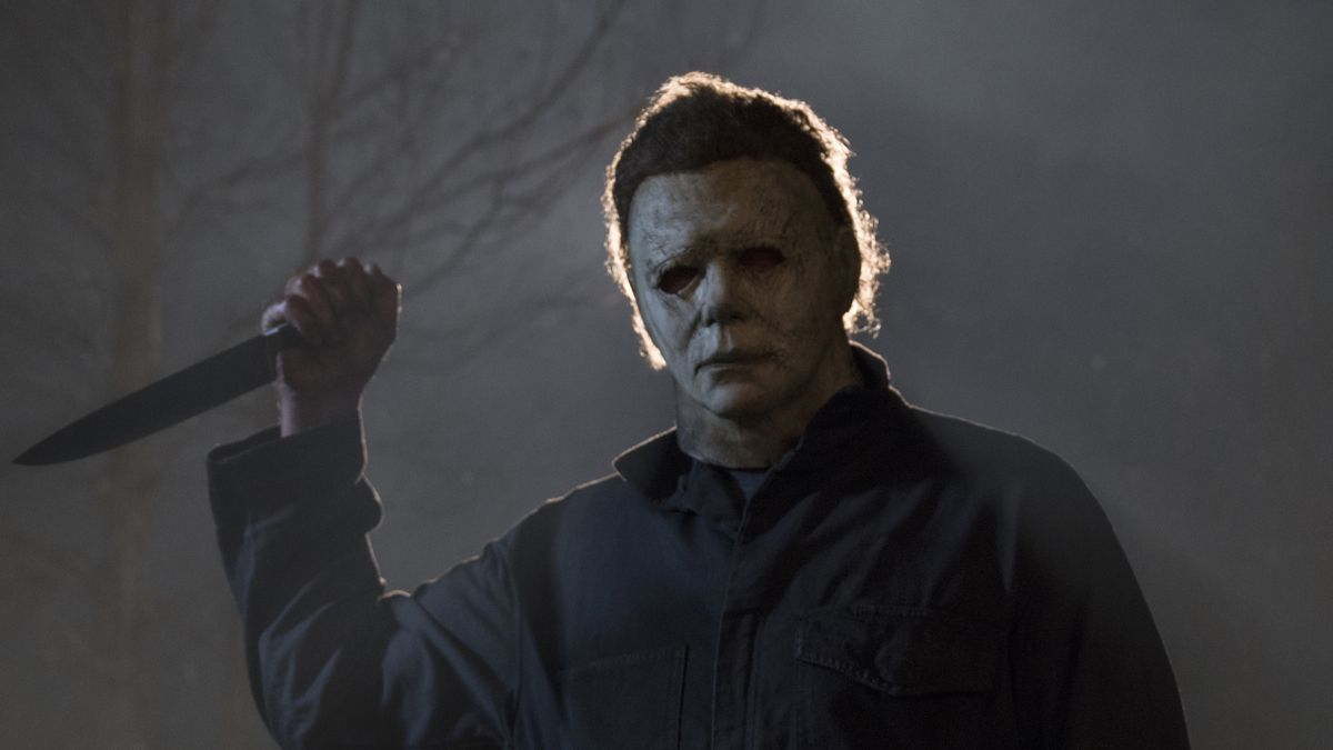 Michael Myers holds a knife menacingly in his white mask in 2018’s Halloween.