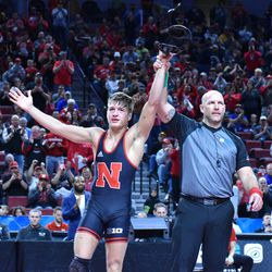 Nebraska’s Bubba Wilson gets his arm raised after downing Minnesota’s Cael Carlson in the first round of the Big Ten Championships Saturday at the Pinnacle Bank Arena in Lincoln.