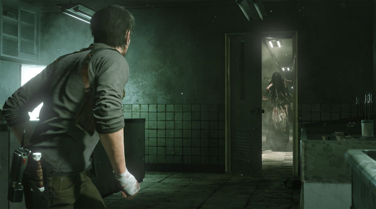 This screenshot from The Evil Within 2 shows main character Sebastian Castellanos facing a door. Beyond the door, a strange ghostly figure can be seen lurching forward. She is wearing tattered, bloody clothes and dark black hair is completely covering her