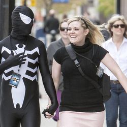 James and Carleigh dressed as Venom and Gwen Stacy, walk toward the Salt Palace to attend Salt Lake Comic Con. People walk around downtown Salt Lake City Friday, April 18, 2014.