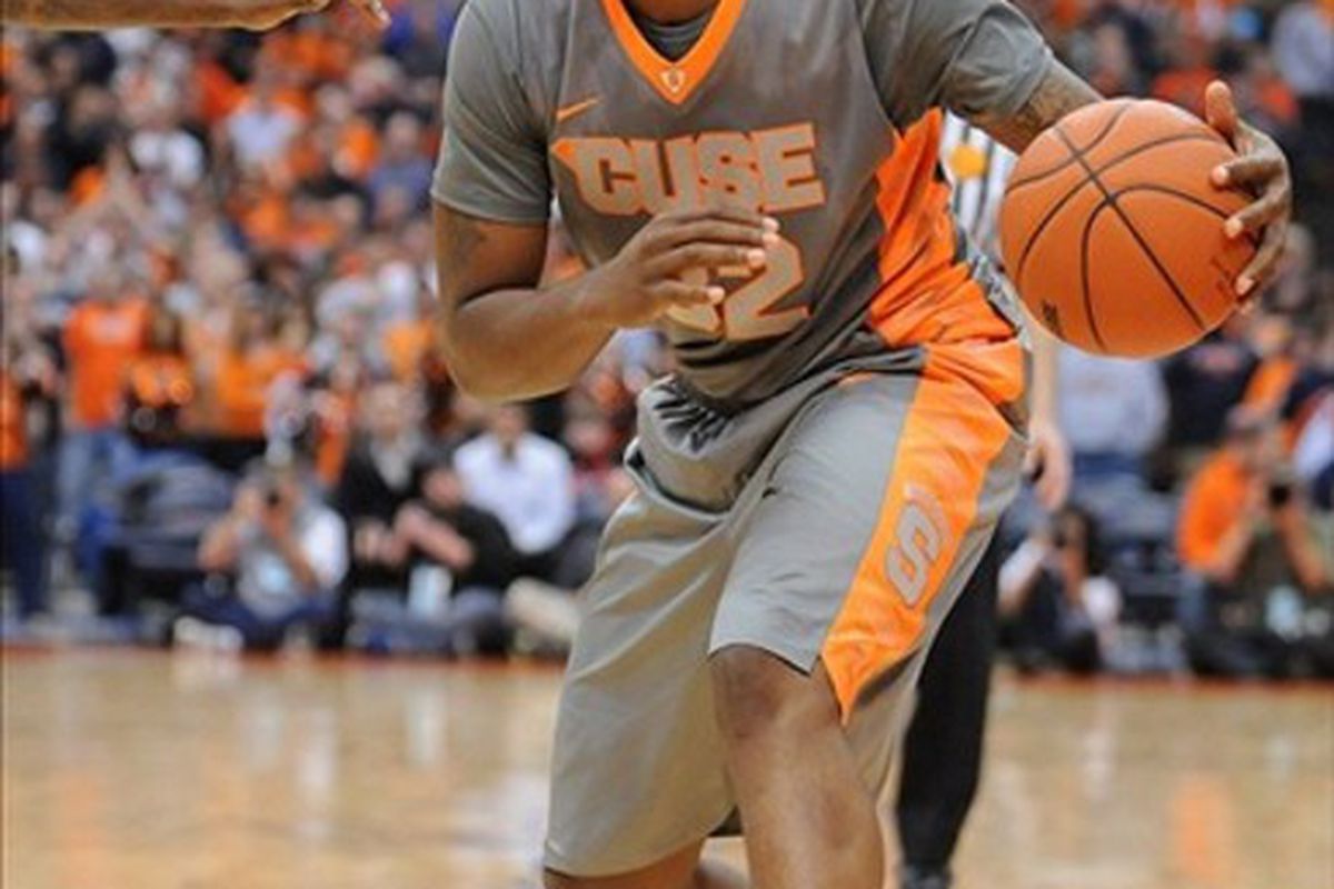 Feb 22, 2012; Syracuse, NY, USA; Syracuse Orange forward Kris Joseph (32) dribbles the ball during the second half of a game against the South Florida Bulls at the Carrier Dome. Syracuse won the game 56-48. Mandatory Credit: Mark Konezny-US PRESSWIRE