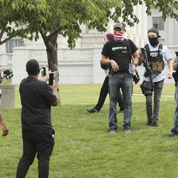 Insurgence USA protesters, left, clash with Utah Citizens’ Alarm members as they rally at the Capitol in Salt Lake City on Wednesday, July 22, 2020.