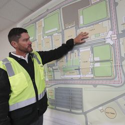 Mike Ambre, assistant director of special projects for the Division of Facilities Construction and Management, shows plans for the new state prison in Salt Lake City on Wednesday, Sept. 11, 2019.