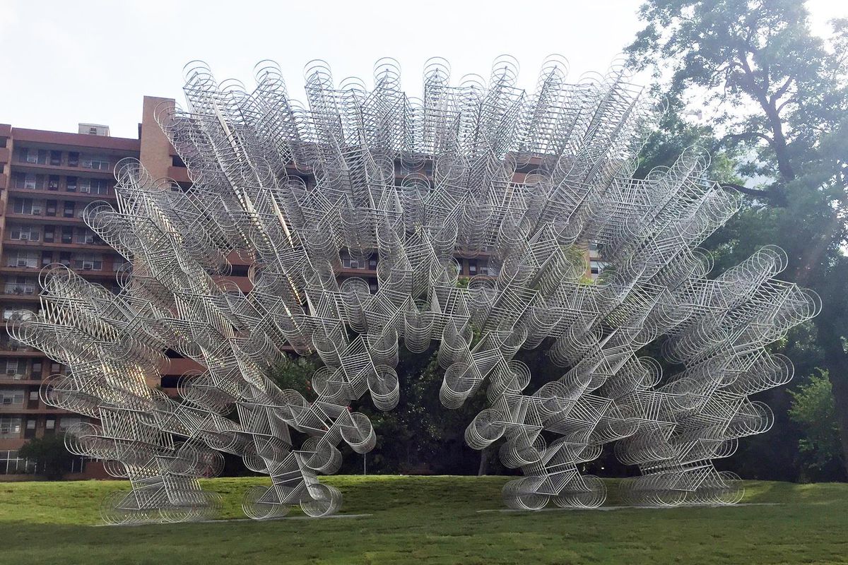 A very large sculpture of stacked bicycles 