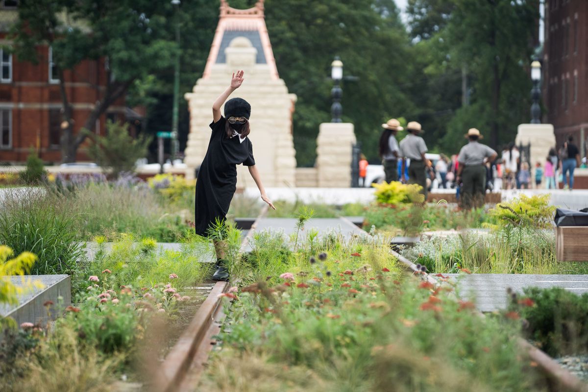 Adeline Peckler plays on what used to be railroad tracks at the Pullman National Monument on its opening day in the Far South Side neighborhood, Saturday afternoon, Sept. 4, 2021.