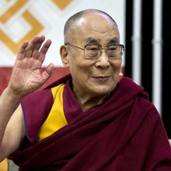FILE - In this June 13, 2016 file photo, the Dalai Lama waves during an event at American University in Washington. President Barack Obama thanked the Dalai Lama on Wednesday, June 14, 2016, for offering condolences after people were killed in the worst mass shooting in modern U.S. history, as the pair once again angered China by meeting at the White House. (AP Photo/Manuel Balce Ceneta, File)