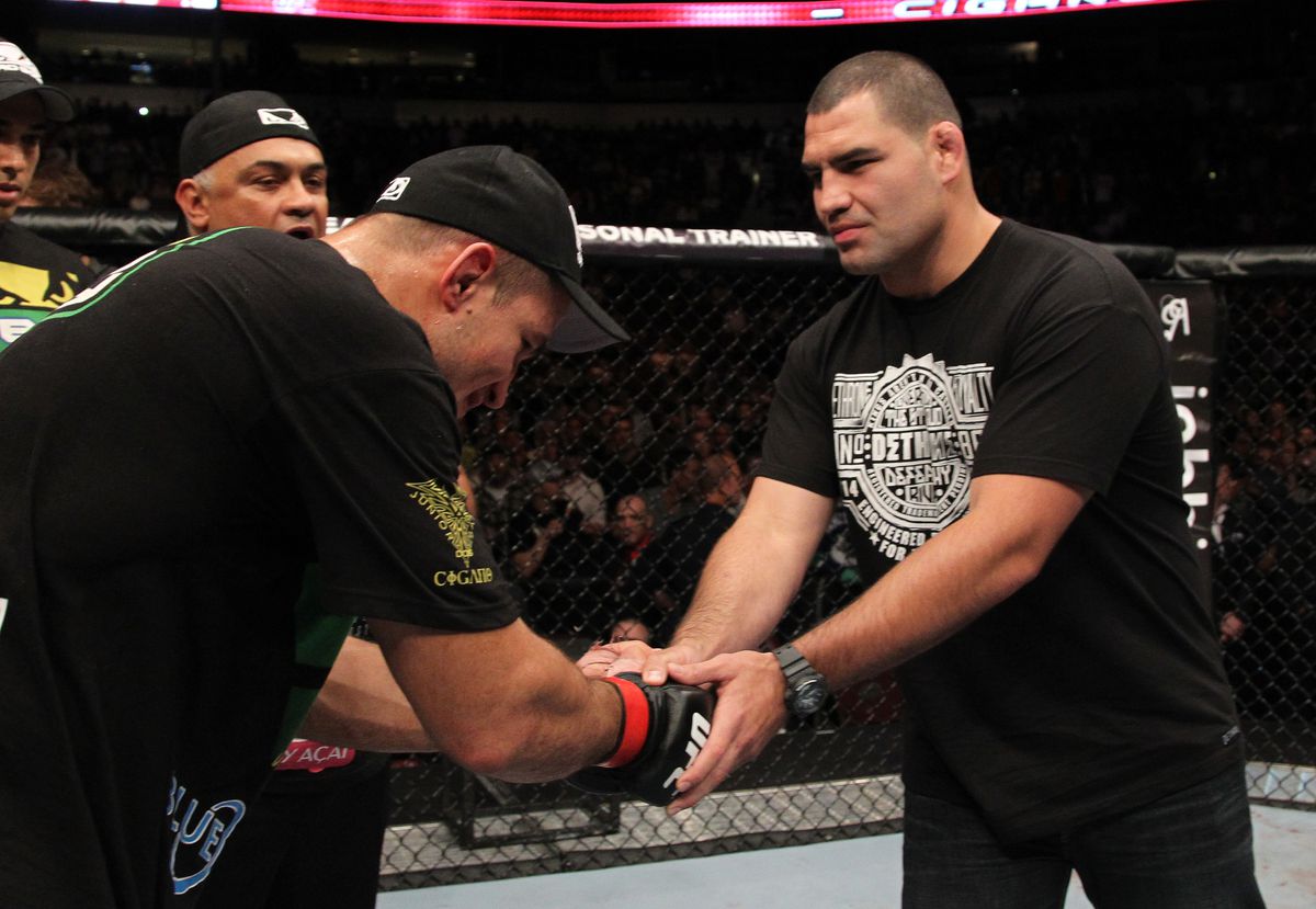 Cain Velasquez and Junior dos Santos share the cage at UFC 131 in Canada. 