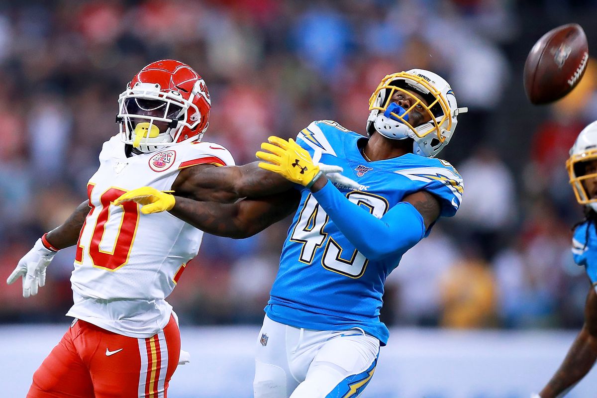 Cornerback Michael Davis of the Los Angeles Chargers breaks up a pass intended for wide receiver Tyreek Hill of the Kansas City Chiefs during the game at Estadio Azteca on November 18, 2019 in Mexico City, Mexico.