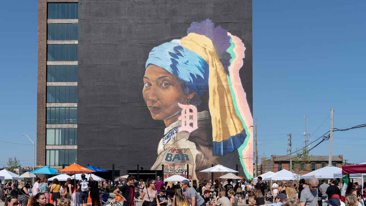 The Girl with the D Earring mural painted by Sydney James in Detroit, Michigan.