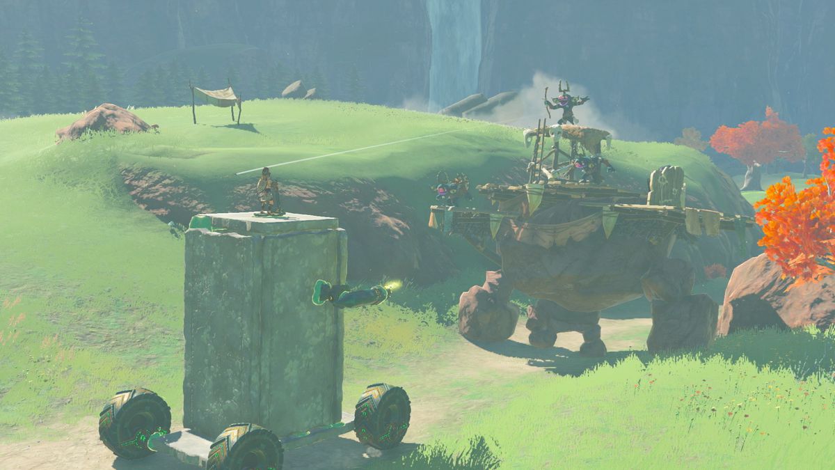 An image of Link riding a stone vehicle constructed by a player in The Legend of Zelda: Tears of the Kingdom 
